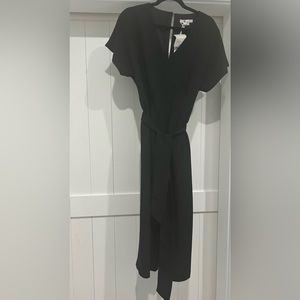 Jumpsuit/ankle length with pockets.